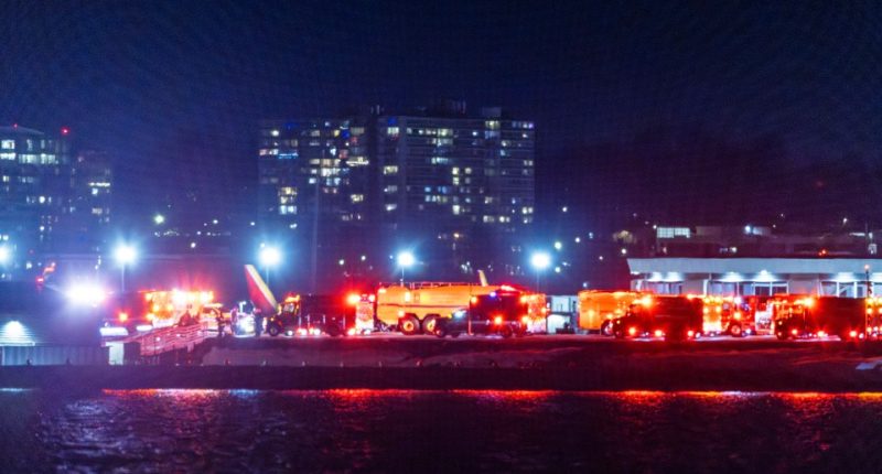 epa11862639 Rescue teams gather to respond to an airplane crash in the Potomac River near Ronald Reagan National Airport in Washington, DC, USA, 29 January 2025. According to a preliminary statement from the United States' Federal Aviation Authority (FAA), a PSA Airlines Bombardier CRJ700 regional jet that departed earlier today from Witchita, Kansas collided in midair with a Sikorsky H-60 helicopter while on approach to Reagan Washington National Airport. EPA/JIM LO SCALZO