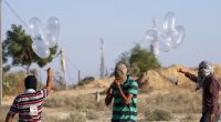 Palestinians preparing incendiary devices attached to condoms near the Gaza-Israel border.