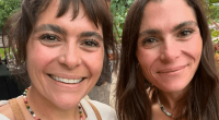 Two women smiling for a selfie.