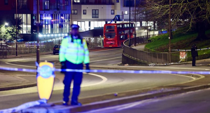 A police officer stands on guard at the cordon