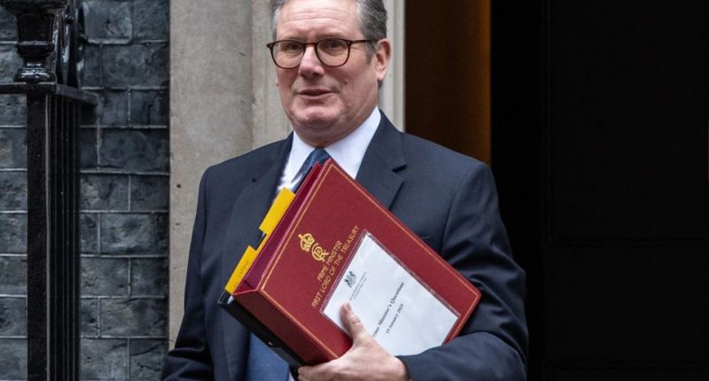 Rishi Sunak carrying Prime Minister's Questions documents.