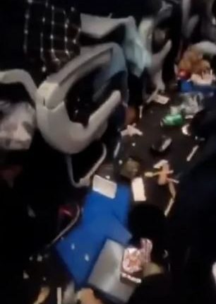 Messy airplane cabin after mid-air turbulence.