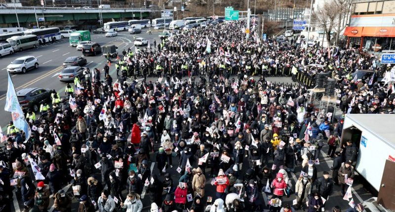 South Korea president DODGES arrest after burly bodyguards form 200-strong human shield to block cops raiding compound