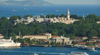 Aerial view of Topkapi Palace in Istanbul, Turkey, with the Golden Horn and Sea of Marmara in the background.