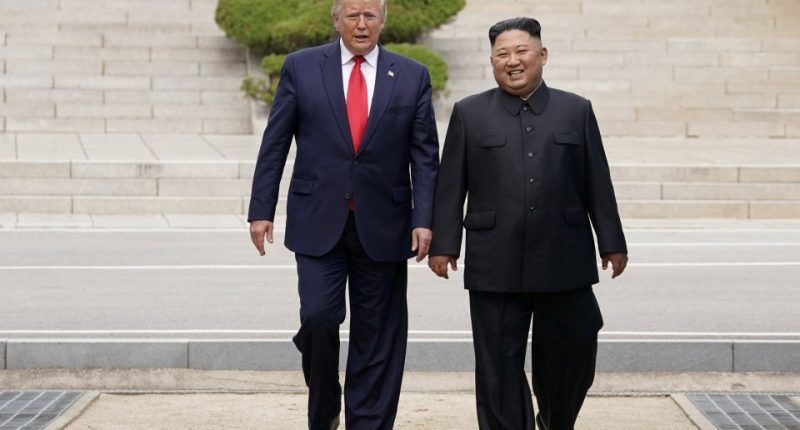 President Trump and Kim Jong Un walking together.