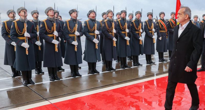 Iranian President Masoud Pezeshkian arriving in Moscow, greeted by honor guard.