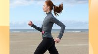 Woman power walking on the beach.