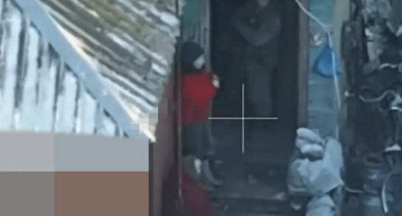 The unidentified North Korean solider chucks the people he is meant to be protecting out onto the street for his own protection