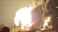 People running from a large explosion and fire.