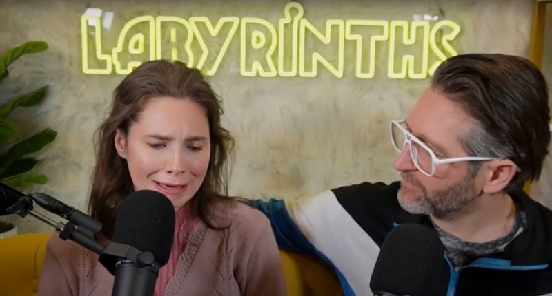 Amanda Knox crying during a podcast interview.
