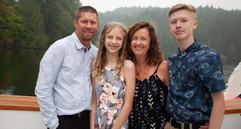 Janis and Blaine Carmena with their two children after buying the abandoned yacht