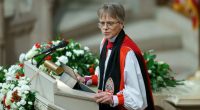 Mariann giving a speech at a podium.