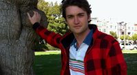 Ross Ulbricht, touching a tree.