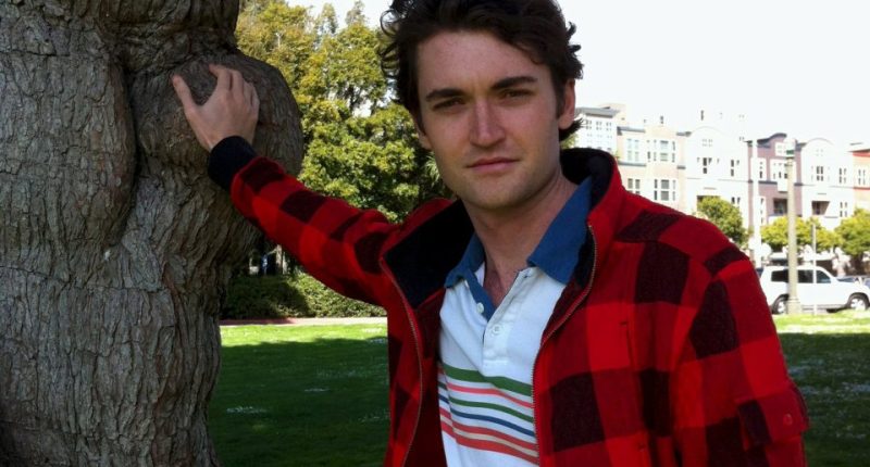Ross Ulbricht, touching a tree.