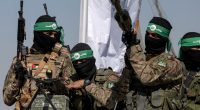Palestinian Hamas fighters in military parade.