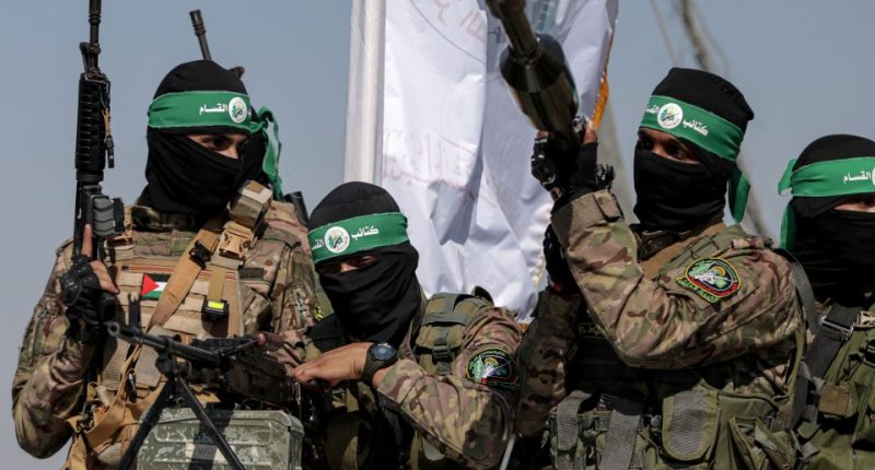 Palestinian Hamas fighters in military parade.