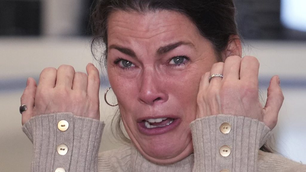 Anguished face of former Olympics star Nancy Kerrigan, whose skating club lost six members to DC plane crash