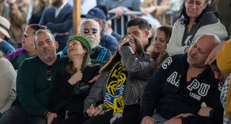 The family of Israeli soldier Sergeant Yahav Maayan who was killed in combat in the Gaza Strip, attends his funeral at a military cemetery in Modiin, Israel, Sunday, Jan. 12, 2025. (AP Photo/Ohad Zwigenberg)