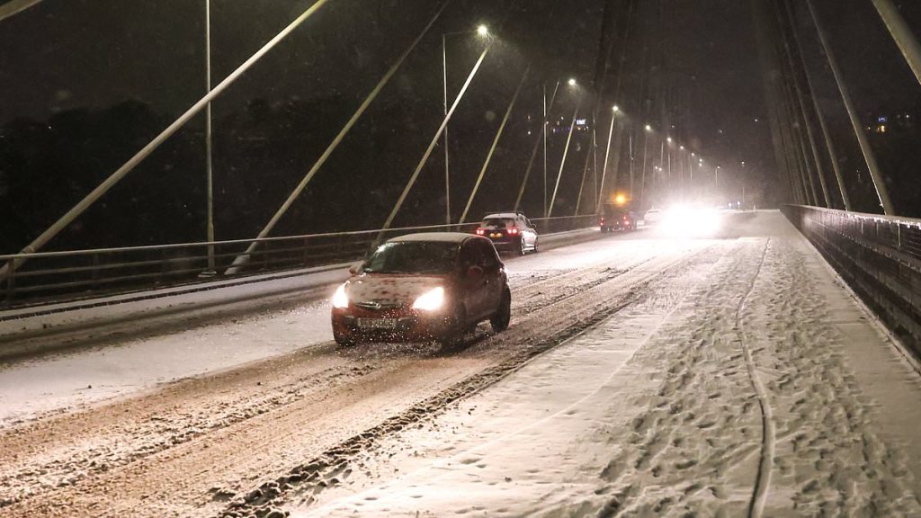 Big Freeze grips Britain: Snow storm causes travel mayhem, with flights grounded in Bristol and roads iced, and blackouts in England and Wales - as amber alert is issued with more than a FOOT set to fall