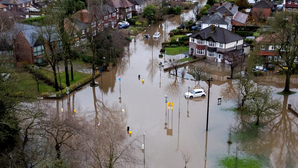 Britain hit by New Year flood chaos: 'Major incident' is declared in Manchester with people trapped in homes, car parks left underwater and canal breaches for first time in 50 years as torrential rain batters North