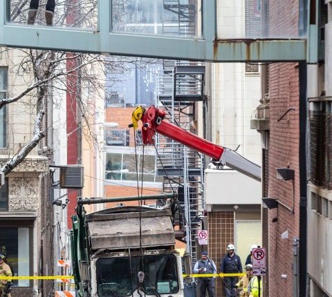 Downtown Omaha loses power for hours after a garbage truck gets stuck in a sinkhole