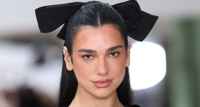 Dua Lipa sheds her chic cape and changes outfit at PFW Chanel show