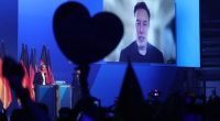 HALLE, GERMANY - JANUARY 25: Tech billionaire Elon Musk speaks live via a video transmission during a speech by Alice Weidel, chancellor candidate of the far-right Alternative for Germany (AfD) political party, at the AfD election campaign launch rally on January 25, 2025 in Halle, Germany. Musk is an outspoken supporter of the AfD and is urging German voters to cast their ballots for the party. The AfD is currently in second place in polls ahead of federal parliamentary snap elections scheduled