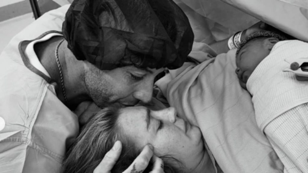 Example reveals girlfriend Daisy Cox has given birth to first child