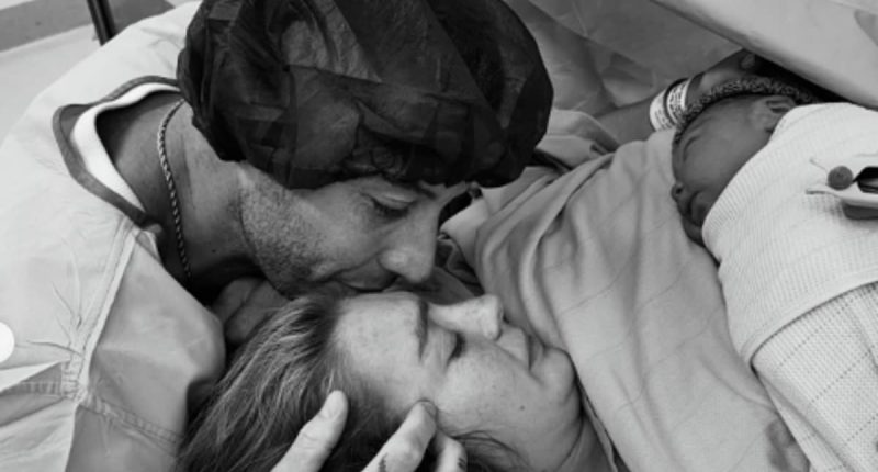 Example reveals girlfriend Daisy Cox has given birth to first child