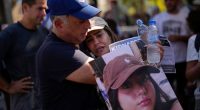 The family of Liri Albag, a hostage who appears in the latest video released by Hamas has called on Israeli Prime Minister Benjamin Netanyahu to seize the opportunity to do a ceasefire deal. Eli, left, and Shira, parents of Liri Albag, hold her photograph at a protest demanding the release of the hostages in Tel Aviv, Israel, in October 2023.