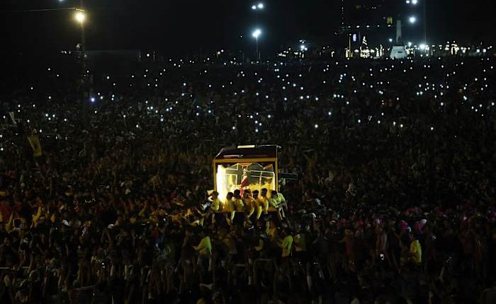 Filipino Catholics pray for good health and peace in huge procession venerating Jesus statue