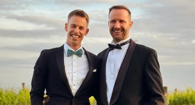 Footy star who made history when he came out as gay has surprise wedding - and a sporting legend flew him to the ceremony in a helicopter