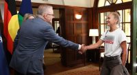 Prime Minister Anthony Albanese and Jodie Haydon greet 2021 Australian of the Year Grace Tame during arrivals for a 2025 Australian of the Year Awards morning tea at the Lodge in Canberra on Saturday 25 January 2025. fedpol Photo: Alex Ellinghausen