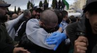 Palestinian prisoners are greeted by a crowd after being released from Israeli prison following a ceasefire agreement with Israel, in the West Bank city of Ramallah, Saturday, Jan. 25, 2025. (AP Photo/Nasser Nasser)