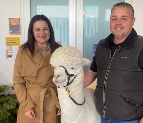 Jacqui Lambie poses with Robert Fletcher and Hephner the alpaca