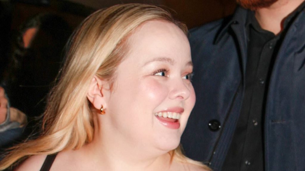 Nicola Coughlan puts on a busty display in black dress in Paris