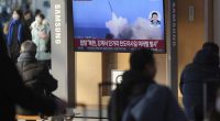 A TV screen shows a report of North Korea's missiles launch with file footage during a news program at the Seoul Railway Station in Seoul, South Korea.