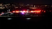 Emergency vehicles gathering near the site of the crash in Washington DC.