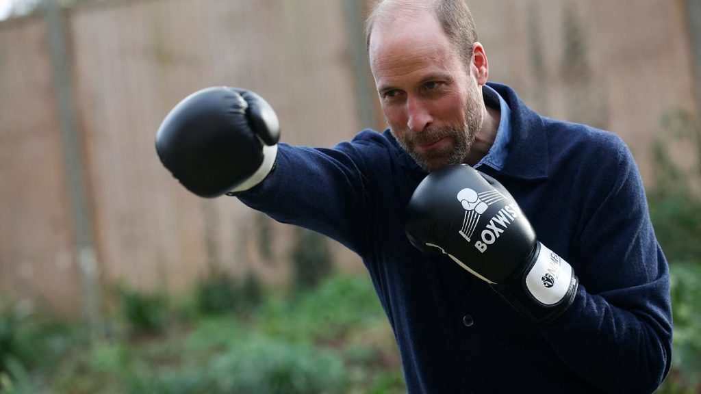 Prince William packs a punch as he spars during boxing class as he visits homeless charity