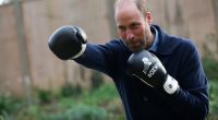 Prince William packs a punch as he spars during boxing class as he visits homeless charity