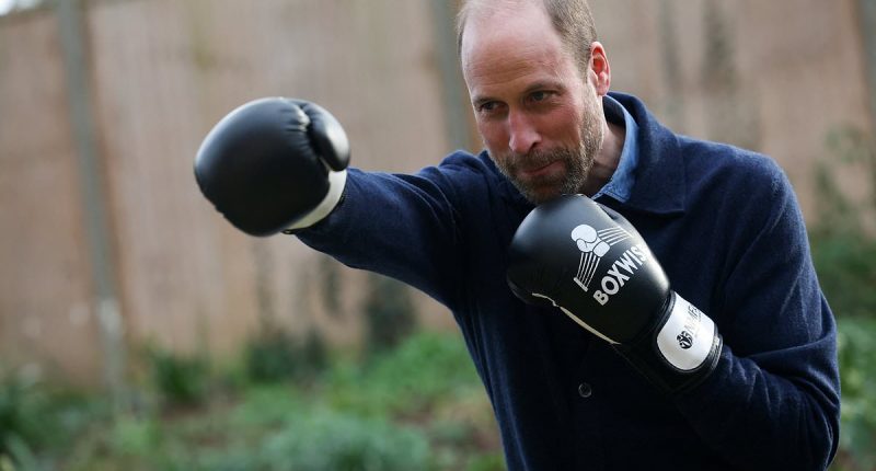 Prince William packs a punch as he spars during boxing class as he visits homeless charity