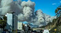 Residents abandon homes and cars to flee out-of-control fire in Pacific Palisades
