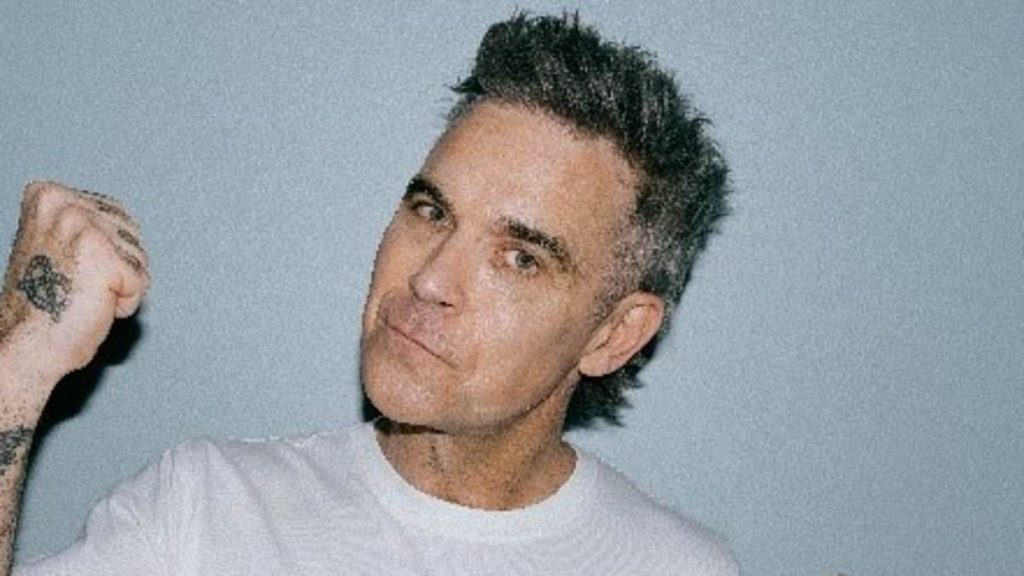 Robbie Williams makes UK chart history as he achieves record Number 1