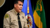 Sheriff calls on wildfire evacuees to be patient amid 'grim' search for bodies
