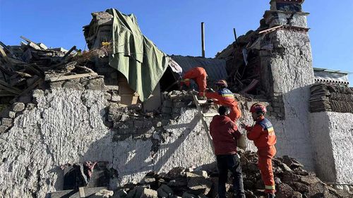 Rescue workers search for survivors in the aftermath of an earthquake in Changsuo Township of Dingri in Xigaze.