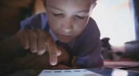 A child using a tablet.