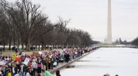People march toward the Lincoln Memorial during the People's March, Saturday, Jan. 18, 2025,
