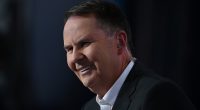 Tony Jones is branded RACIST in stunning human rights complaint that calls for him to be sacked for mocking Novak Djokovic - as Serb star's hidden message to fans is revealed