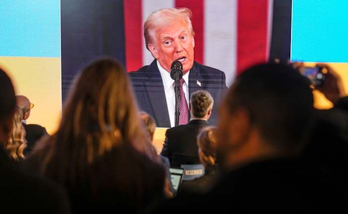 Trump's first day actions loom large as Davos begins