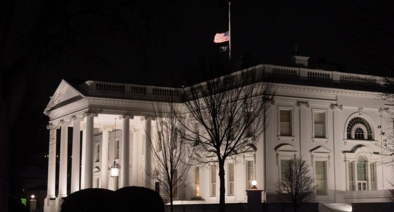 Why are US flags being flown at half-staff on Inauguration Day?